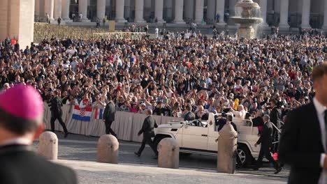 Pope-Francis-greeting-people-in-his-car-Popemobile-at-St