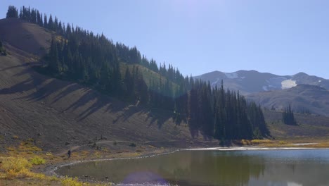 Person-Trekking-By-The-Lake-At-Panorama-Ridge-In-Garibaldi-Provincial-Park,-British-Columbia,-Canada