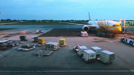 4k-Time-lapse-ground-staff-Preparing-the-aircraft-before-flight-Loading-of-baggage-Food-for-flight-services-and-equipment-before-boarding-the-airplane-at-night-time