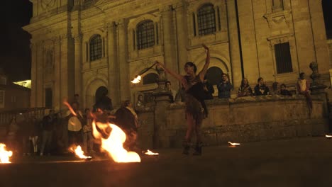 Nighttime-Fire-performance-in-the-streets-of-Lugo-City-from-Medieval-Festival,-Slow-motion
