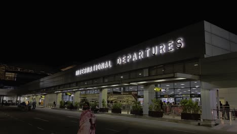Static-shot-of-outdoors-of-international-departure-of-Hydrabad-Airport-in-India-for-international-flight-operation-at-night-time