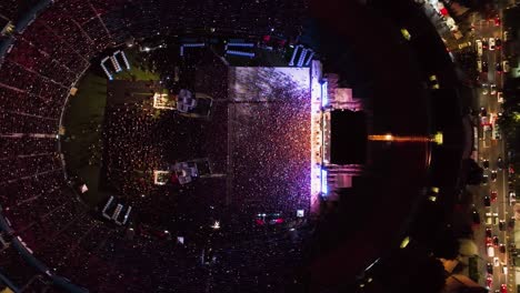 Aerial-view-above-people-inside-the-Ciudad-de-los-deportes-Stadium,-during-Concert-night-in-Mexico-city---top-down,-drone-shot