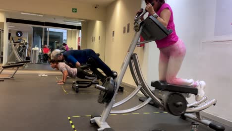 slow-motion-shot-of-people-exercising-in-a-gym