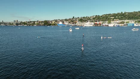 Aerial-view-of-people-having-fun-in-Lake-Union-riding-electric-surfboards
