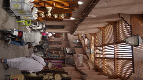 Vertical-establishing-shot-busy-Marrakesh-traditional-market-with-hand-made-souvenirs-and-products