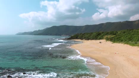Drone-flight-over-picturesque-Amami-Beach-on-tropical-island,-Japan