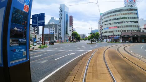 Tram-driving-through-Kagoshima-city-in-Japan---POV-shot-from-front