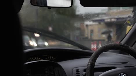 Rainy-day-traffic-in-London,-seen-through-windshield-of-a-Toyota-car