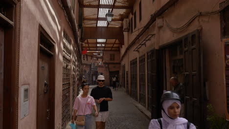 people-walking-through-cobblestone-streets-of-Morocco