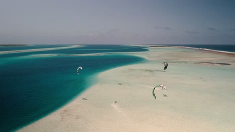 Kite-safari-caribbean-sea,-drone-shot-man-start-kitesurf-on-turquoise-sea-water,-Los-Roques