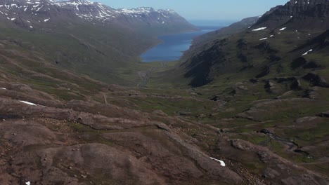 Mjóifjörður-fjord-in-remote-east-Iceland-with-mountainous-landscape,-aerial