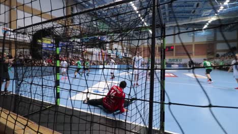Handball-Match,-Man,-SEHA,-Europe,-look-behind-net-and-goal