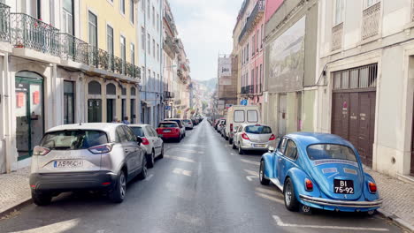 Long-Street-in-Old-Town-District-of-Lisbon-with-Oldtimer-Car-during-Day