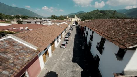 Aerial-FPV-shot-of-arch-street-of-Antigua-Guatemala