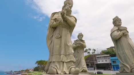 Angra-dos-Reis,-Rio-de-Janeiro,-Brazil---October-31,-2022-Low-Angle-Statue-of-the-three-kings-in-Angra-dos-Reis-on-Anil-beach