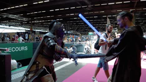 Slowmotion-shot-of-two-cosplayers-fighting-each-other-at-the-Japan-Expo-2022