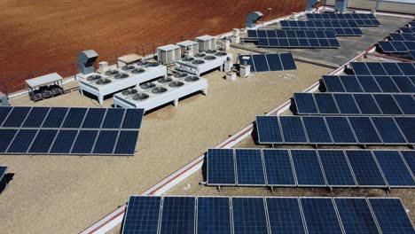 Aerial-View-of-Solar-Panels-and-AC-Units-on-Top-of-Shopping-Mall-in-Puente-Benil,-Spain