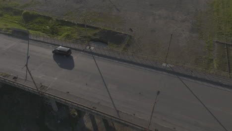 Drone-shot-of-cars-driving-on-highway-bridge,-DTLA,-Georgia