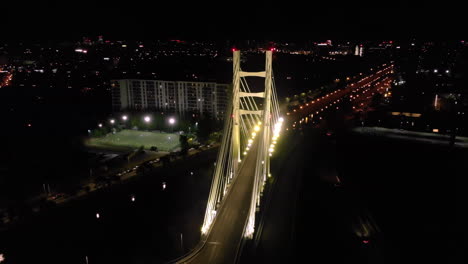 Ciurel-Bridge-overpass-suspension-bridge-aerial-view-at-night,-Bucharest-Romania