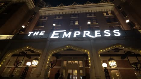 The-magnificent-Empress-Hotel-in-British-Columbia-Canada-illuminated-at-night-with-a-camera-pan-down