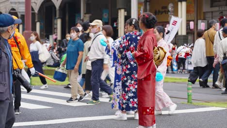 Women-wear-iconic-traditional-Japanese-Yukata-at-Ohara-Festival,-Kagoshima