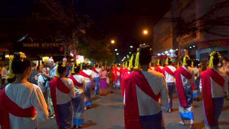 POV-walking-with-women-during-traditional-Yi-Peng-Parade-in-Thailand
