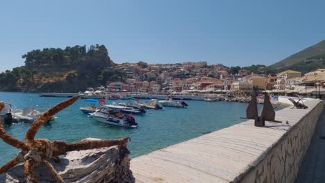Motorboats-anchored-off-Parga-seaside-town,-Greece