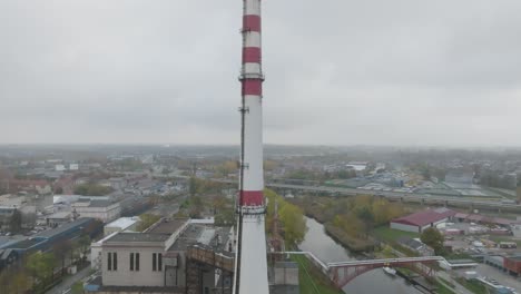 An-aerial-view-of-a-heat-pipe-chimney-in-an-industrial-district-on-a-cloudy-autumn-morning