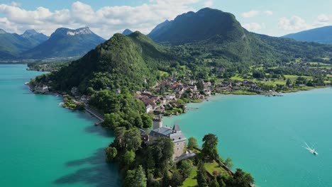 Chateau-Duingt-and-Turquoise-Light-Blue-Lake-Annecy-in-French-Alps---Aerial