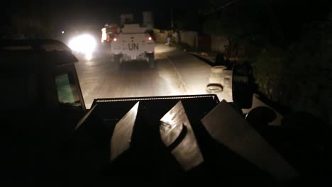 POV-from-United-Nations-armoured-truck,-night-mission