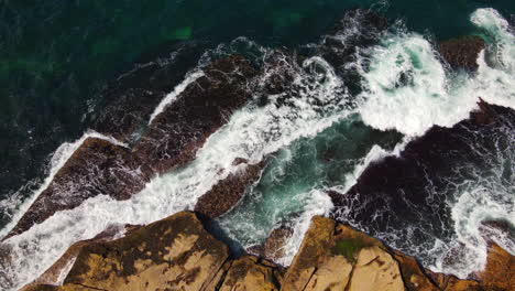 The-sea-waves-crashing-against-the-beach-cliffs