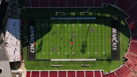 Aerial-view-above-the-Bearcats-practicing-inside-the-Nippert-Stadium,-in-Cincinnati,-USA---top-down,-drone-shot