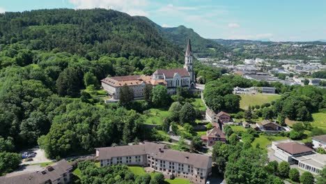 Annecy-Monastry-Monastere-De-La-Visitation-on-a-hill-in-French-Alps---Aerial