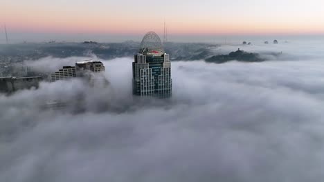 Aerial-view-towards-the-Great-American-tower,-foggy-morning-in-Cincinnati,-USA
