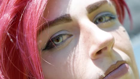 Close-up-shot-of-a-red-hair-female-character-on-show-at-the-Japanese-Expo-in-Paris,-France