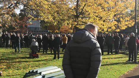 Community-gathering-at-UK-park-memorial-Cenotaph-paying-respect-on-remembrance-Sunday-service