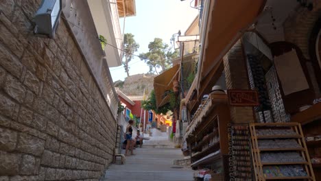 Tranquil-scene-of-Steep-narrow-street-with-souvenir-shops