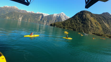 Group-of-tourists-on-kayak-tour-at-Milford-Sound-fjord,-New-Zealand