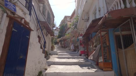 A-small-cultural-Greek-styled-street-with-stairs-in-Parga,-Greece