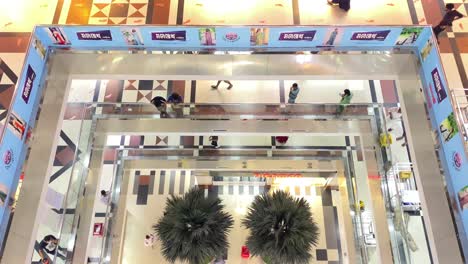 Shopping-mall-with-different-floors-and-people-walking-inside-it