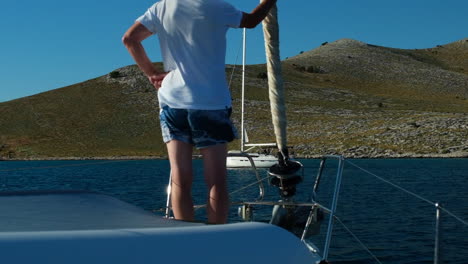 The-sailing-boat-is-about-to-anchor-with-the-unrecognizable-body-of-a-man