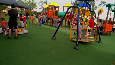 A-lot-of-kids-playin-in-the-public-playgarden-in-Asuncion,-Paraguay