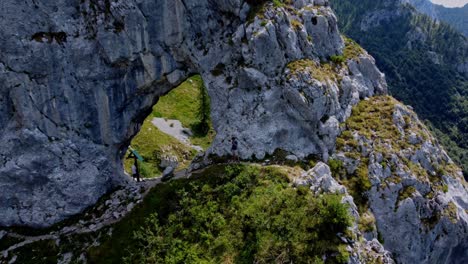 People-Exploring-Rock-Formation-In-Mountains-Near-Como-Lake,-Porta-Di-Prada-Plave,-Italy