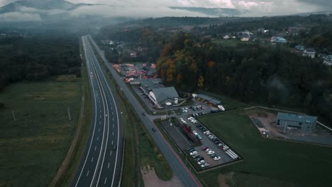 Aerial-Footage-of-Highway-and-Cars-in-Foggy-Autumn-Morning