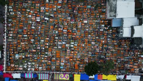 People-queuing-to-the-church-at-the-Mixquic-cementary,-during-Dia-de-Muertos---aerial-view