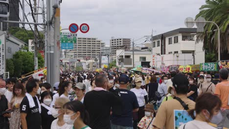 Japanese-People-Walk-Through-Streets-at-Summer-Festival