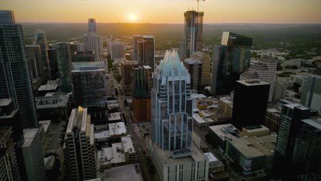 Aerial-view-overlooking-the-downtown-of-Austin,-sunset-in-Texas,-USA---circling,-drone-shot