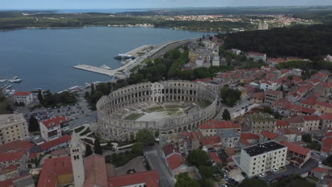 Drone-shot-of-the-Amphitheater-in-Pula,-Croatia---drone-is-flying-around-the-ancient-Roman-site