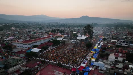 Mixquic-graveyard-and-church,-during-dia-de-los-muertos-celebrations,-dusk-in-Mexico-city---Aerial-view