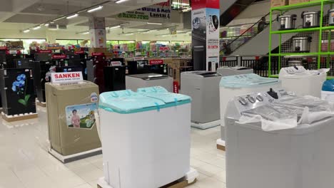 On-display-are-several-new-washing-machines-in-the-store-with-competitive-prices